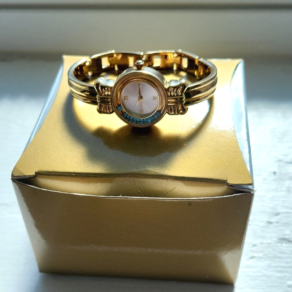 Gold Dress Watch with Metal Band and Circular Face